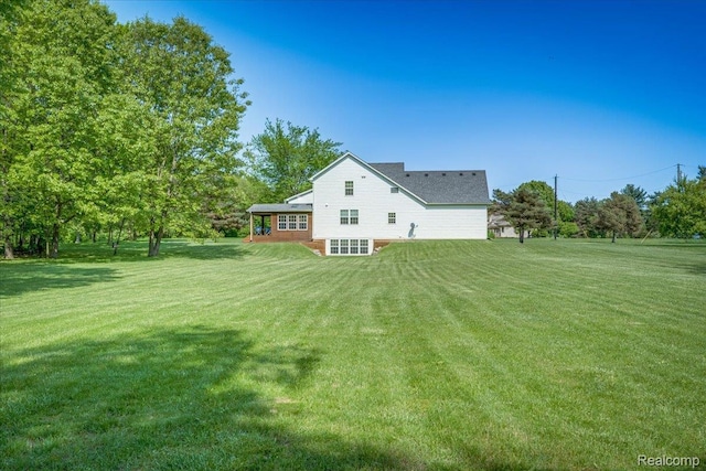 10726 Davisburg Rd, Davisburg, MI 48350 - rear view of property with a lawn