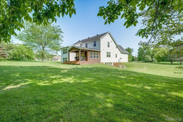 10726 Davisburg Rd, Davisburg, MI 48350 - rear view of house featuring a deck and a lawn