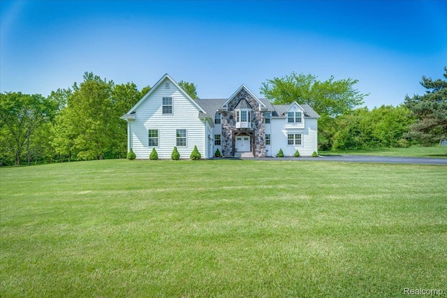 10726 Davisburg Rd, Davisburg, MI 48350 - traditional-style home with stone siding and a front yard