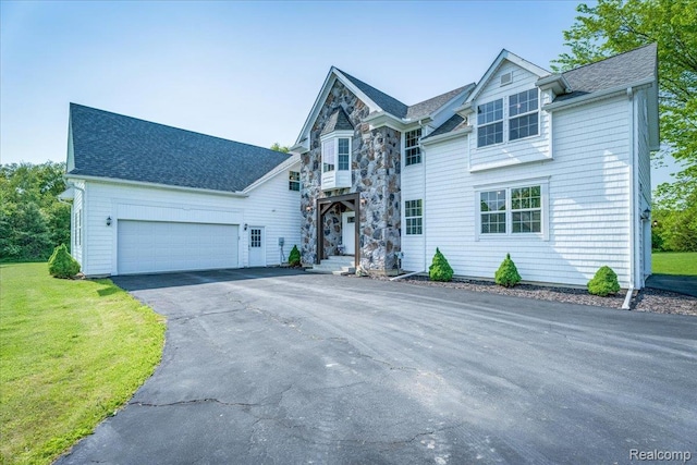 10726 Davisburg Rd, Davisburg, MI 48350 - view of front facade with a garage, driveway, a front lawn, and a shingled roof