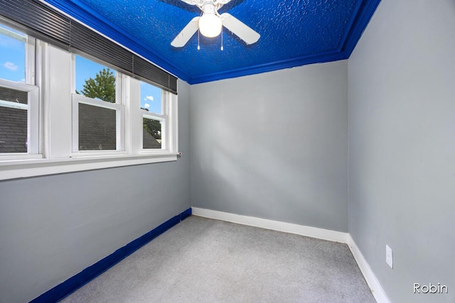1032 White Ave NW, Grand Rapids, MI 49504 - empty room featuring carpet, baseboards, and ceiling fan