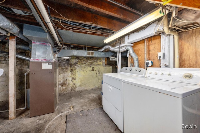 1032 White Ave NW, Grand Rapids, MI 49504 - unfinished below grade area featuring washer and dryer and heating unit