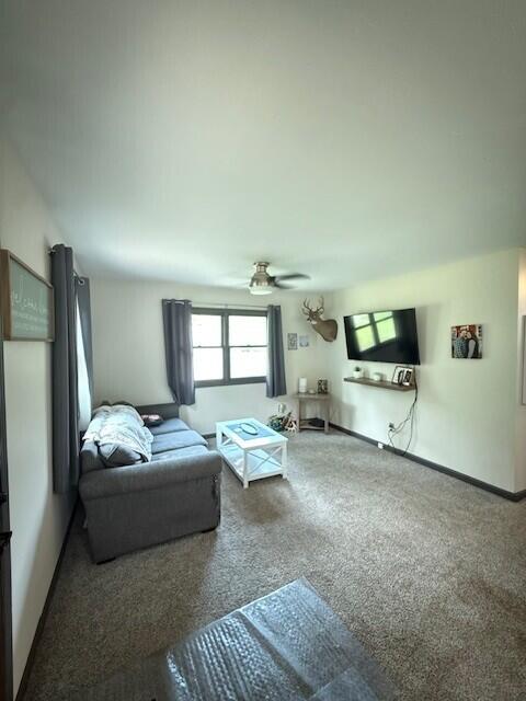 17912 130th Ave, Nunica, MI 49448 - living room featuring carpet flooring and ceiling fan