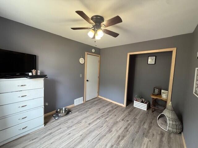17912 130th Ave, Nunica, MI 49448 - bedroom with wood finished floors, baseboards, and ceiling fan