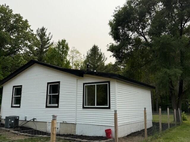 17912 130th Ave, Nunica, MI 49448 - view of side of home with cooling unit