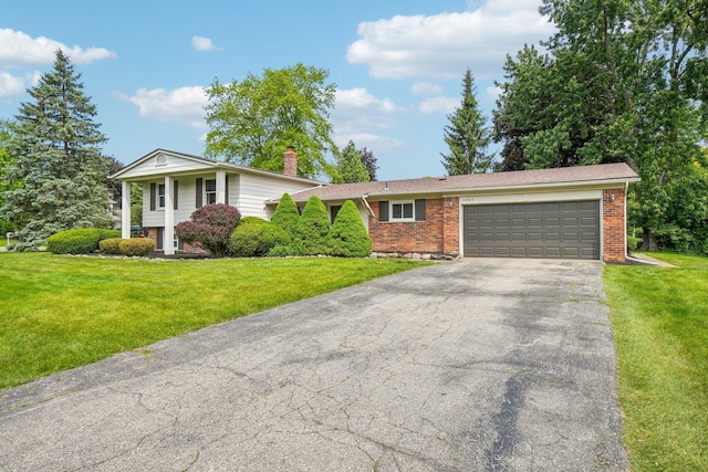 6883 Tamerlane Dr, West Bloomfield, MI 48322 - view of front facade featuring a garage, driveway, a front yard, a chimney, and brick siding