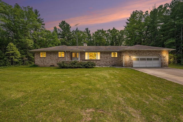 3765 Ryerson Rd, Twin Lake, MI 49457 - single story home featuring a garage, concrete driveway, a lawn, a chimney, and brick siding