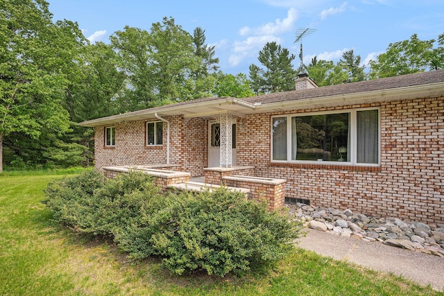3765 Ryerson Rd, Twin Lake, MI 49457 - ranch-style house featuring a chimney and brick siding