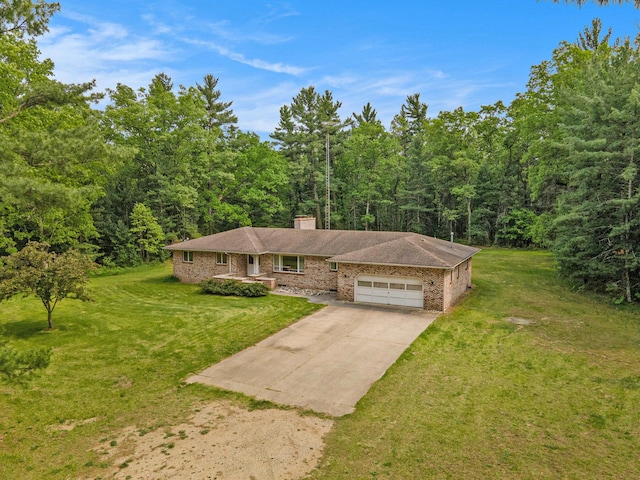 3765 Ryerson Rd, Twin Lake, MI 49457 - view of front facade featuring a garage, brick siding, driveway, a forest view, and a chimney