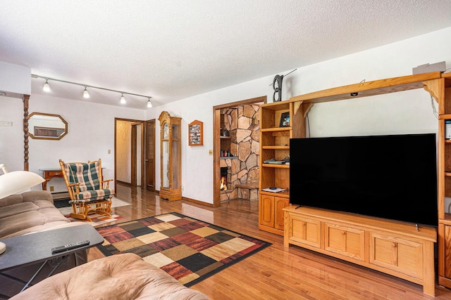 3765 Ryerson Rd, Twin Lake, MI 49457 - living room with light wood finished floors and a textured ceiling