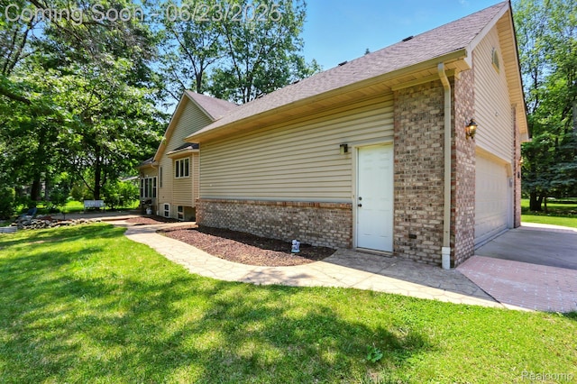 11970 Diamond Dr, Shelby Twp, MI 48315 - view of side of property featuring brick siding, a lawn, driveway, a shingled roof, and a garage