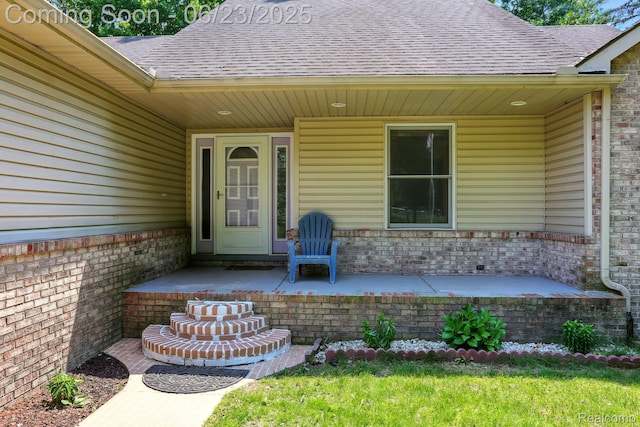 11970 Diamond Dr, Shelby Twp, MI 48315 - doorway to property featuring brick siding, roof with shingles, and covered porch