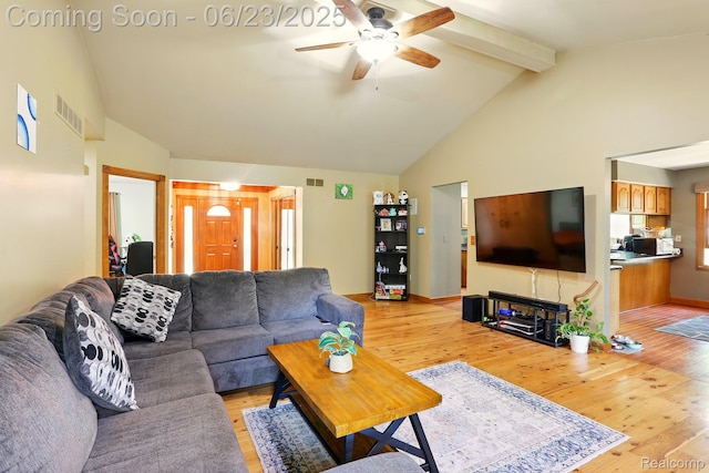 11970 Diamond Dr, Shelby Twp, MI 48315 - living room with a ceiling fan, light wood-type flooring, beamed ceiling, and high vaulted ceiling