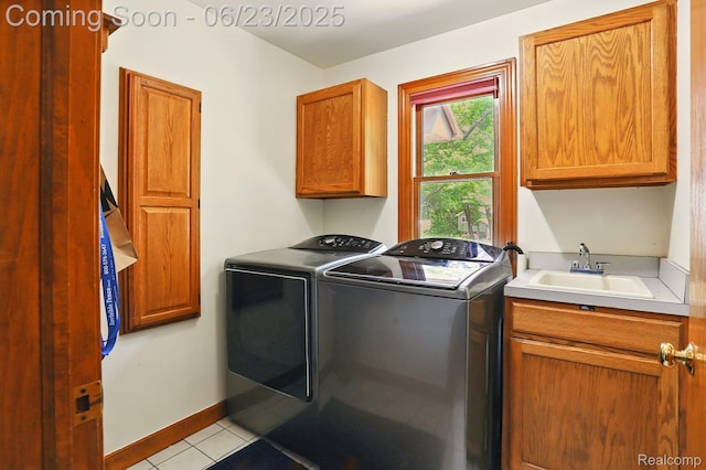 11970 Diamond Dr, Shelby Twp, MI 48315 - laundry area featuring cabinet space, separate washer and dryer, and light tile patterned floors