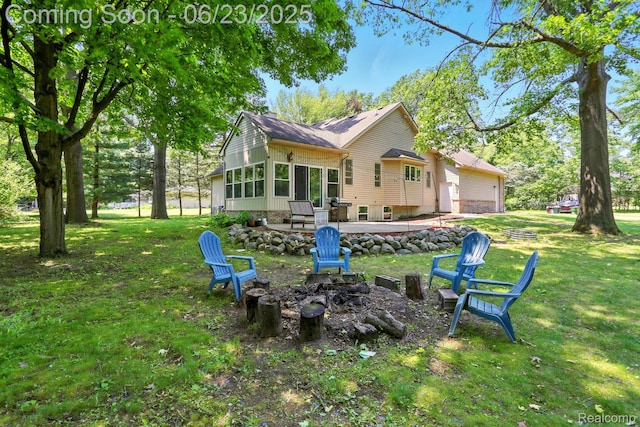 11970 Diamond Dr, Shelby Twp, MI 48315 - rear view of house featuring an outdoor fire pit, a lawn, a chimney, and a patio area