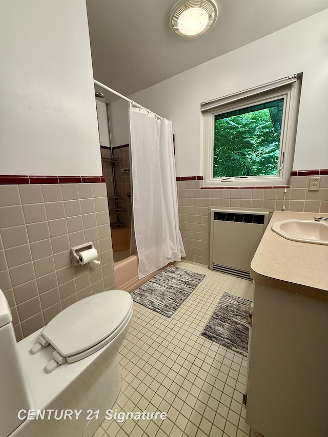 1486 Lathrup Ave, Saginaw, MI 48638 - bathroom with tile walls, tile patterned flooring, wainscoting, radiator, and vanity