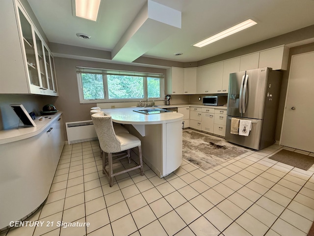 1486 Lathrup Ave, Saginaw, MI 48638 - kitchen with appliances with stainless steel finishes, light countertops, a sink, glass insert cabinets, and white cabinetry