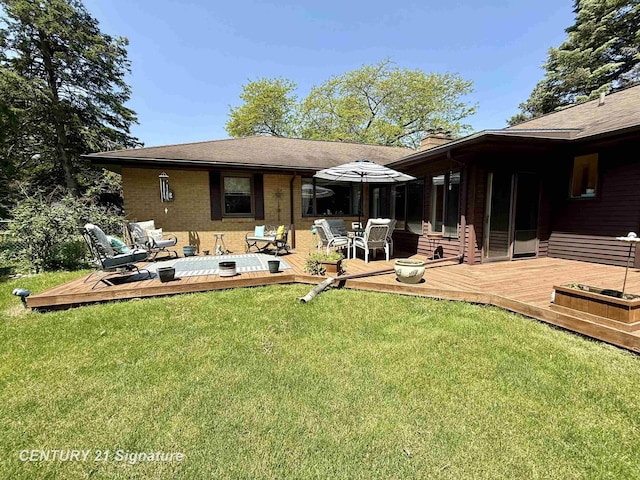 1486 Lathrup Ave, Saginaw, MI 48638 - back of property featuring a chimney, a deck, a yard, and outdoor lounge area