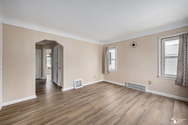 1989 Leblanc St, Lincoln Park, MI 48146 - spare room with wood finished floors, baseboards, and arched walkways