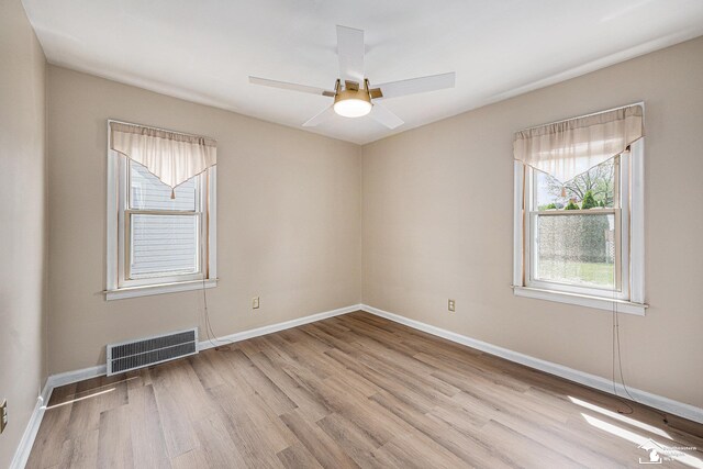 1989 Leblanc St, Lincoln Park, MI 48146 - unfurnished room featuring light wood-style floors, baseboards, and a ceiling fan