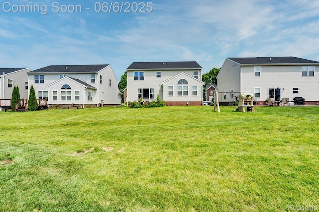 59625 Twin Pines Dr, New Hudson, MI 48165 - back of house featuring a yard