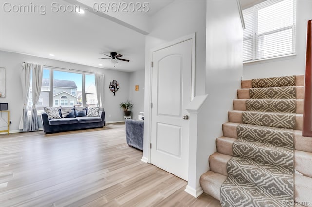 59625 Twin Pines Dr, New Hudson, MI 48165 - stairway featuring a ceiling fan, wood finished floors, baseboards, and recessed lighting