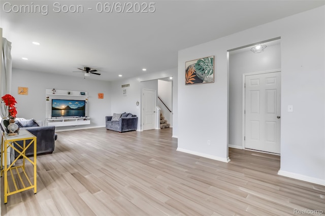59625 Twin Pines Dr, New Hudson, MI 48165 - living room with ceiling fan, stairway, light wood finished floors, baseboards, and recessed lighting