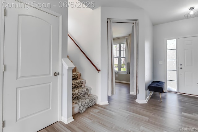59625 Twin Pines Dr, New Hudson, MI 48165 - foyer entrance featuring light wood-type flooring, baseboards, and stairs