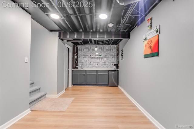 59625 Twin Pines Dr, New Hudson, MI 48165 - indoor bar with fridge, decorative backsplash, light wood-style flooring, stairs, and baseboards