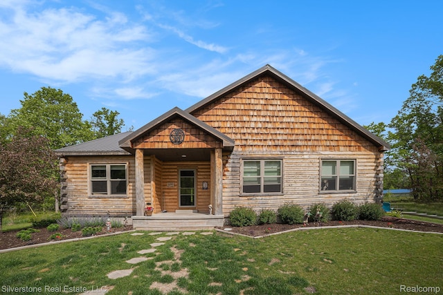 2816 W K Bar L Dr, Midland, MI 48640 - cabin with a front yard and log exterior