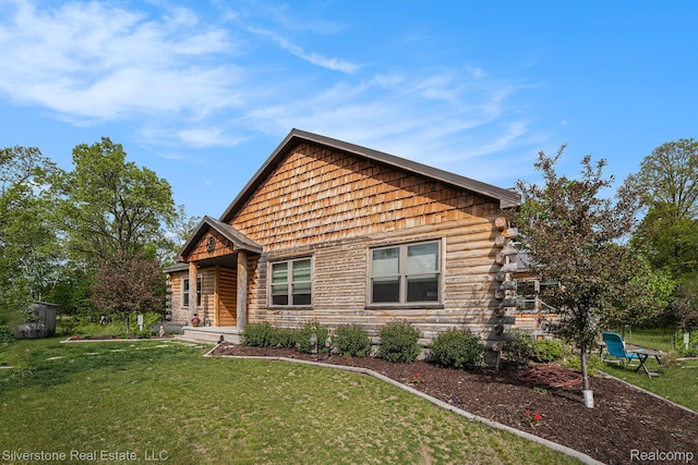 2816 W K Bar L Dr, Midland, MI 48640 - cabin featuring a front lawn