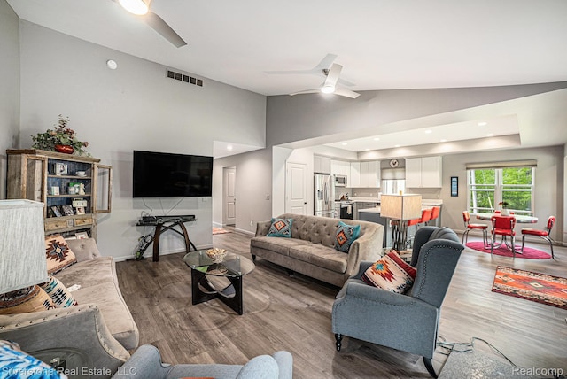 2816 W K Bar L Dr, Midland, MI 48640 - living area featuring ceiling fan, lofted ceiling, and wood finished floors