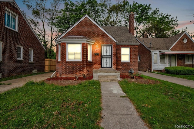 18519 Morang Dr, Detroit, MI 48205 - bungalow-style home featuring a chimney, brick siding, and a shingled roof