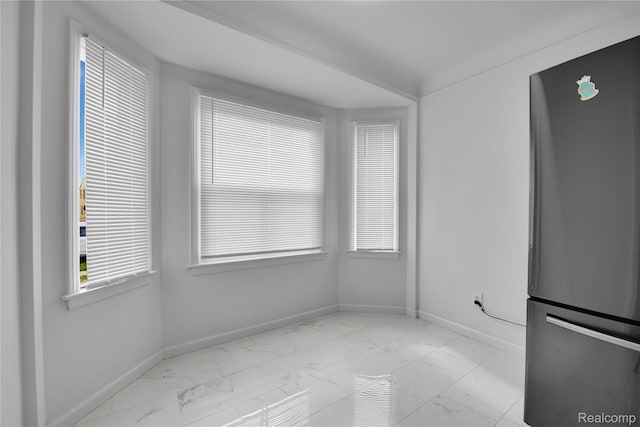 18519 Morang Dr, Detroit, MI 48205 - unfurnished dining area featuring marble look tile flooring and baseboards