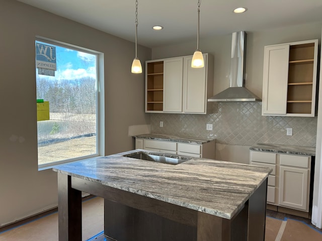 2924 Sheridan Cir Unit 57, Jackson, MI 49201 - kitchen featuring wall chimney exhaust hood, open shelves, light stone countertops, white cabinets, and recessed lighting
