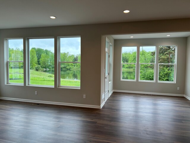 2924 Sheridan Cir Unit 57, Jackson, MI 49201 - spare room with plenty of natural light, recessed lighting, and dark wood-style floors