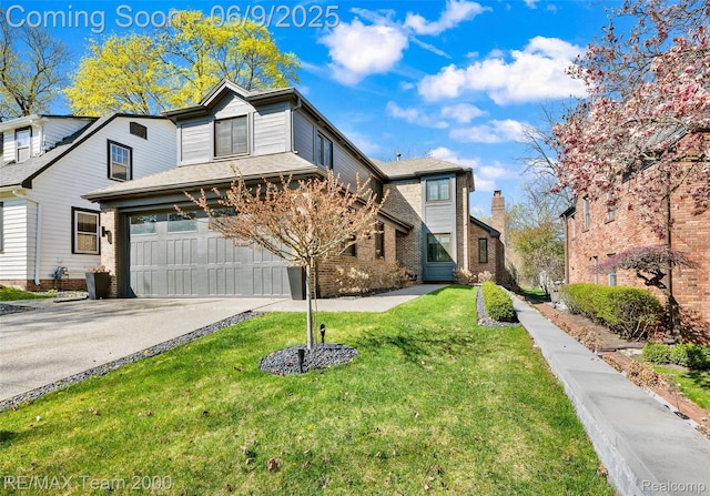 636 Morley Ct, Dearborn, MI 48124 - traditional-style home with driveway, a front yard, an attached garage, and brick siding