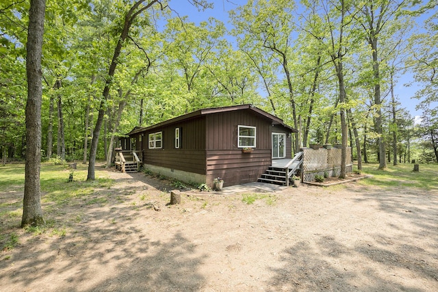 3274 E Rivers Edge, Newaygo, MI 49337 - view of front of house featuring a deck and crawl space