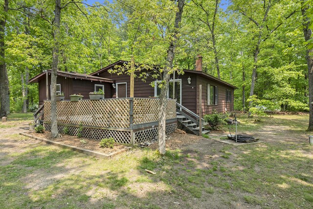 3274 E Rivers Edge, Newaygo, MI 49337 - rear view of house featuring a chimney