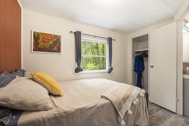 3274 E Rivers Edge, Newaygo, MI 49337 - bedroom featuring wood finished floors and a closet