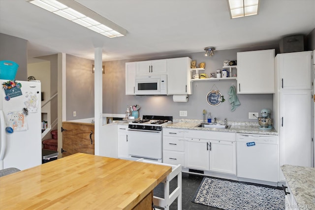 749 Gates Ave, Ypsilanti, MI 48198 - kitchen with white appliances, white cabinetry, a sink, and open shelves
