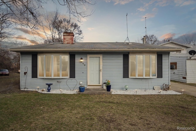 749 Gates Ave, Ypsilanti, MI 48198 - view of front of property featuring a chimney and a lawn