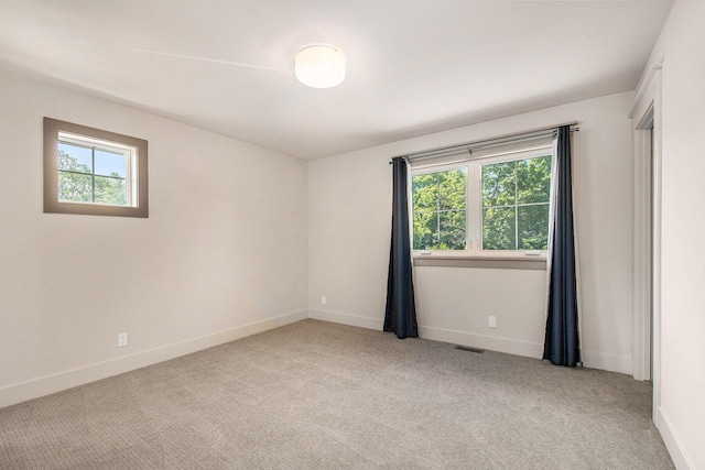 2234 Lake Dr SE, East Grand Rapids, MI 49506 - unfurnished room with light carpet and baseboards