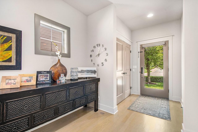 2234 Lake Dr SE, East Grand Rapids, MI 49506 - entrance foyer featuring wood finished floors, baseboards, and recessed lighting