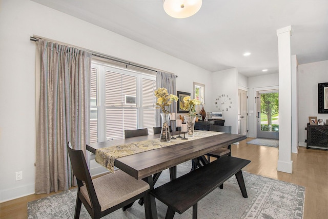 2234 Lake Dr SE, East Grand Rapids, MI 49506 - dining area featuring decorative columns, light wood-style flooring, baseboards, and recessed lighting