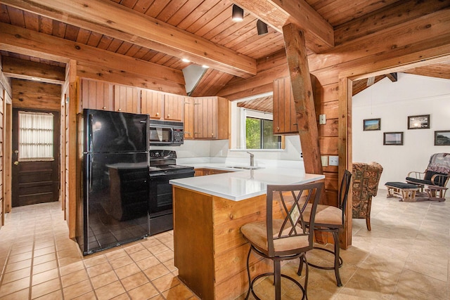 77125 Pinewood Ln, South Haven, MI 49090 - kitchen with black appliances, wood ceiling, a sink, light countertops, and a peninsula
