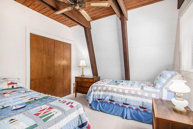77125 Pinewood Ln, South Haven, MI 49090 - carpeted bedroom featuring wooden ceiling with exposed beams, a closet, and a ceiling fan