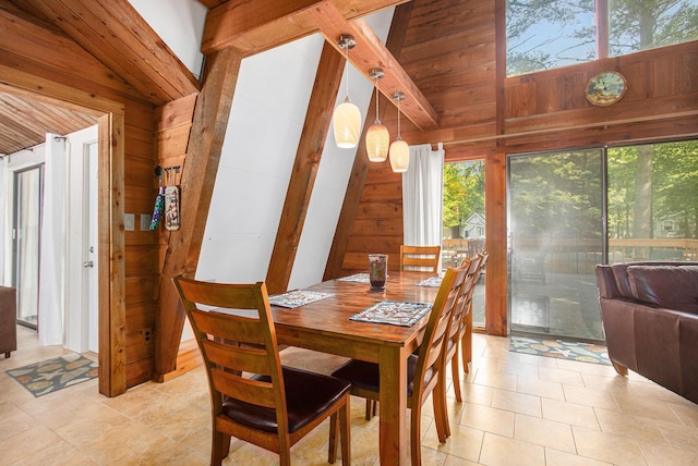 77125 Pinewood Ln, South Haven, MI 49090 - dining area with wooden walls and light tile patterned floors