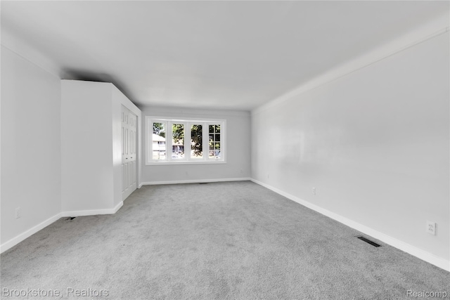 20930 Stahelin Rd, Southfield, MI 48075 - carpeted empty room with baseboards