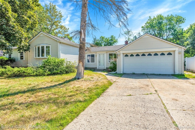 20930 Stahelin Rd, Southfield, MI 48075 - single story home with concrete driveway, a front yard, and a garage